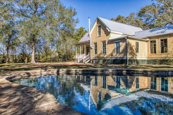 a front view of a house with lake view