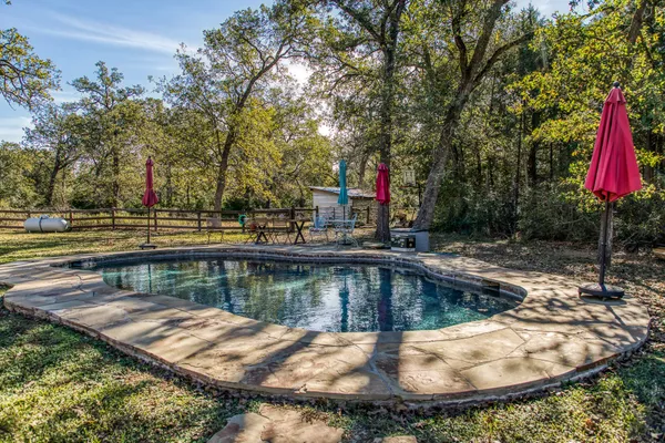 a view of a swimming pool with a patio