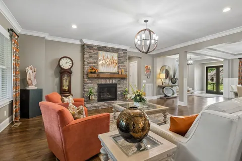 a kitchen with stainless steel appliances a stove a sink island and a refrigerator