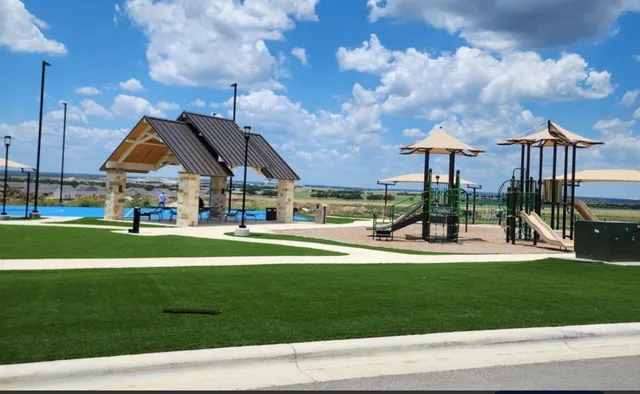 a picture of a room with a white wall and a large window