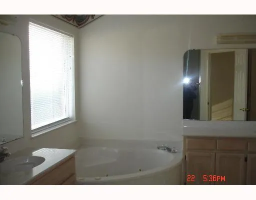 a bathroom with a bathtub and a sink
