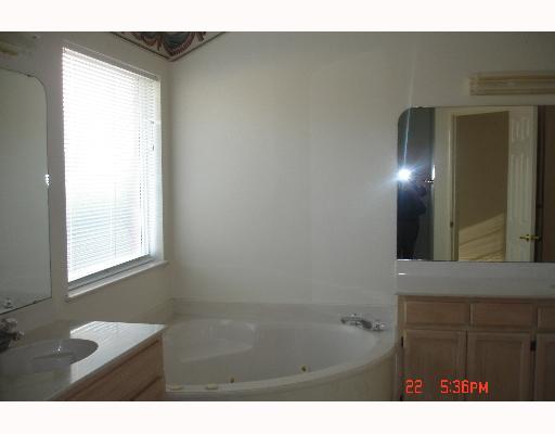 5022 Queen's Court Corpus Christi, TX 78413 - Photo 8 of 9 a bathroom with a bathtub and a sink
