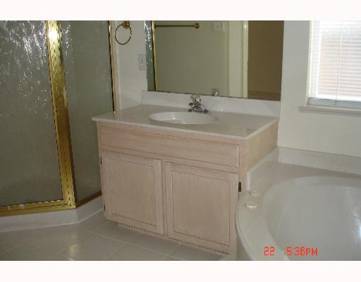 5022 Queen's Court Corpus Christi, TX 78413 - Photo 9 of 9 a bathroom with a sink and a mirror