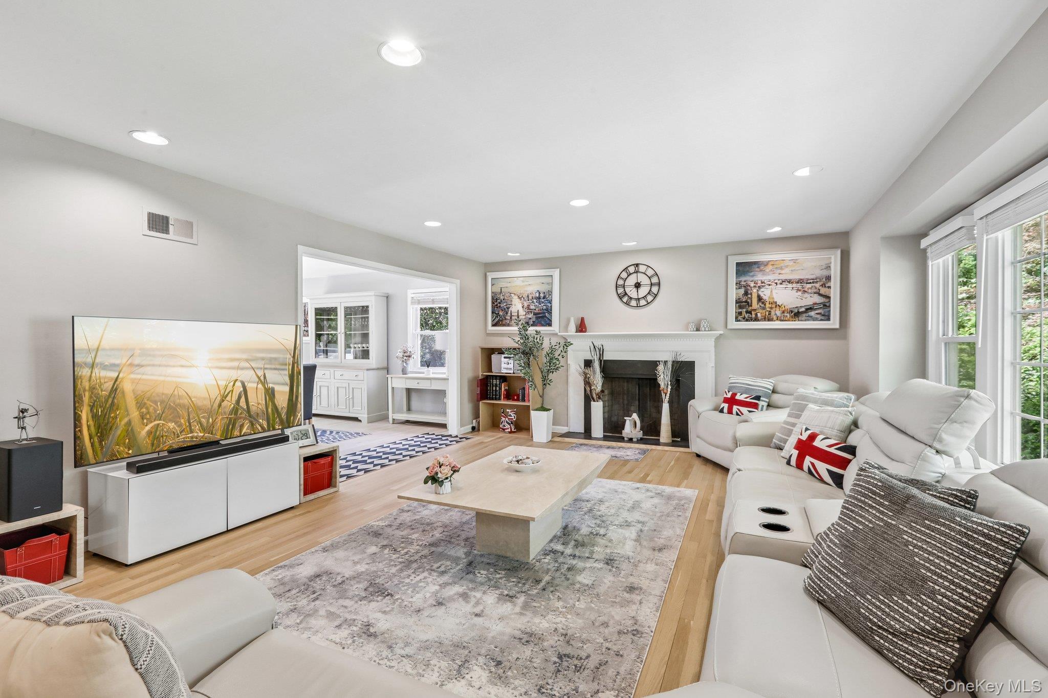 62 Mohegan Road Larchmont, NY 10538 - Photo 13 of 46 a living room with furniture and a flat screen tv
