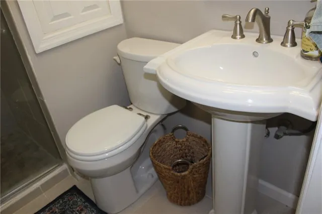 a bathroom with a toilet and a sink