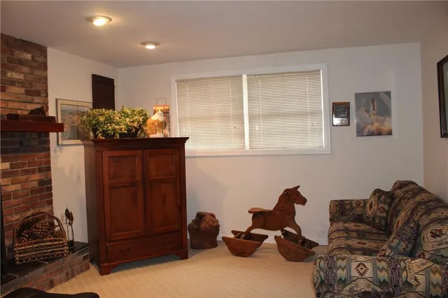 a living room with furniture windows and a flat screen tv