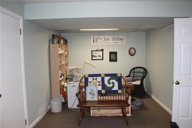 a view of livingroom with furniture and white walls
