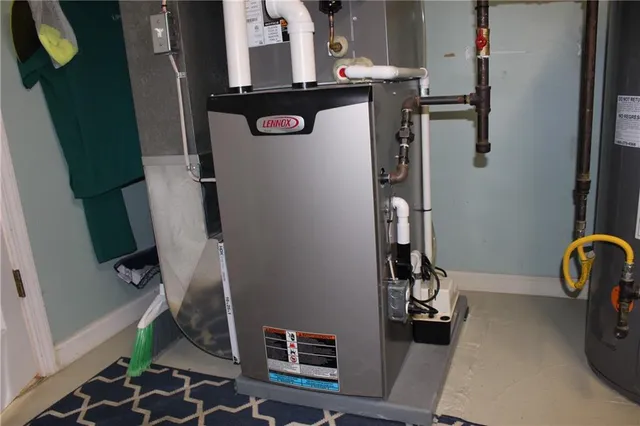 a backyard of a house with a table and chairs