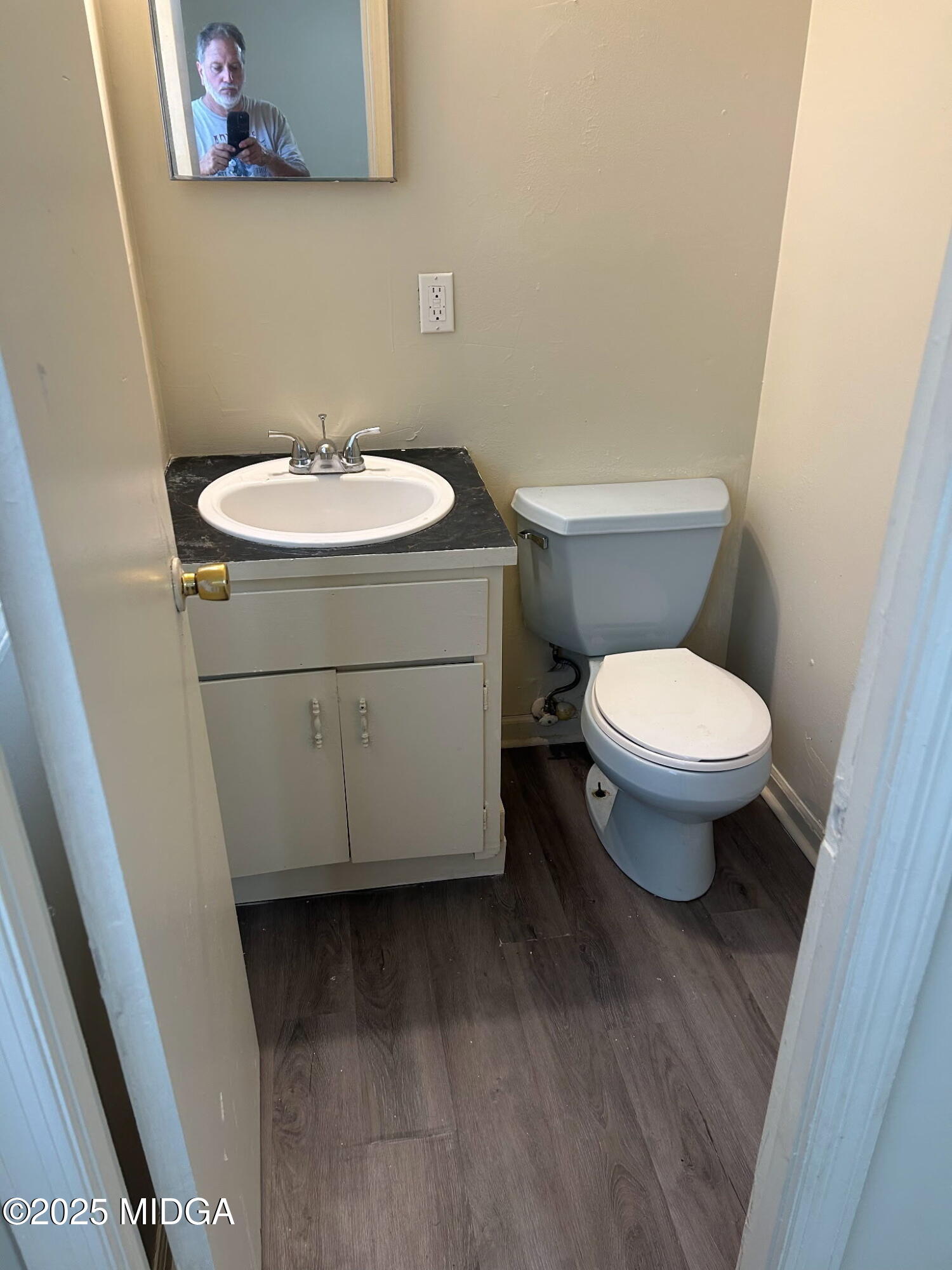 2751 Village Green Lane Macon, GA 31206 - Photo 3 of 10 a white toilet sitting next to a bathroom sink