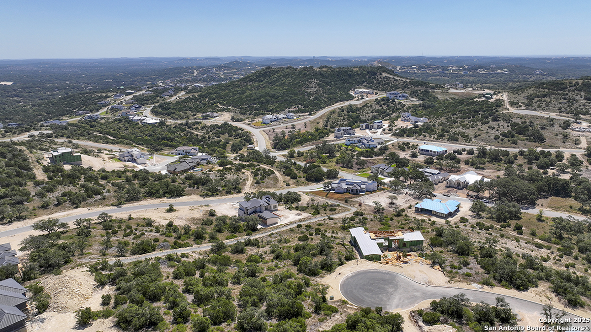 23328 Ebner Ridge San Antonio, TX 78255 - Photo 13 of 29 an aerial view of residential house with parking and trees
