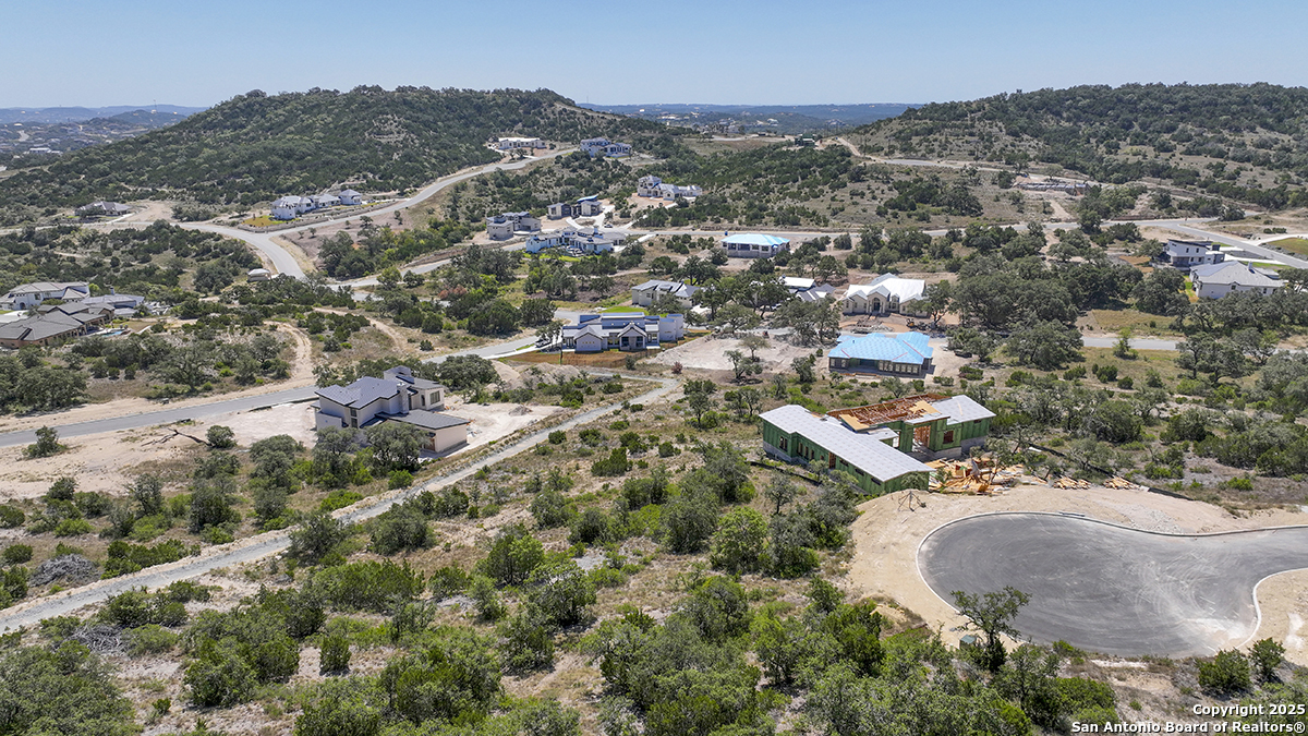 23328 Ebner Ridge San Antonio, TX 78255 - Photo 3 of 29 an aerial view of residential house and car parked