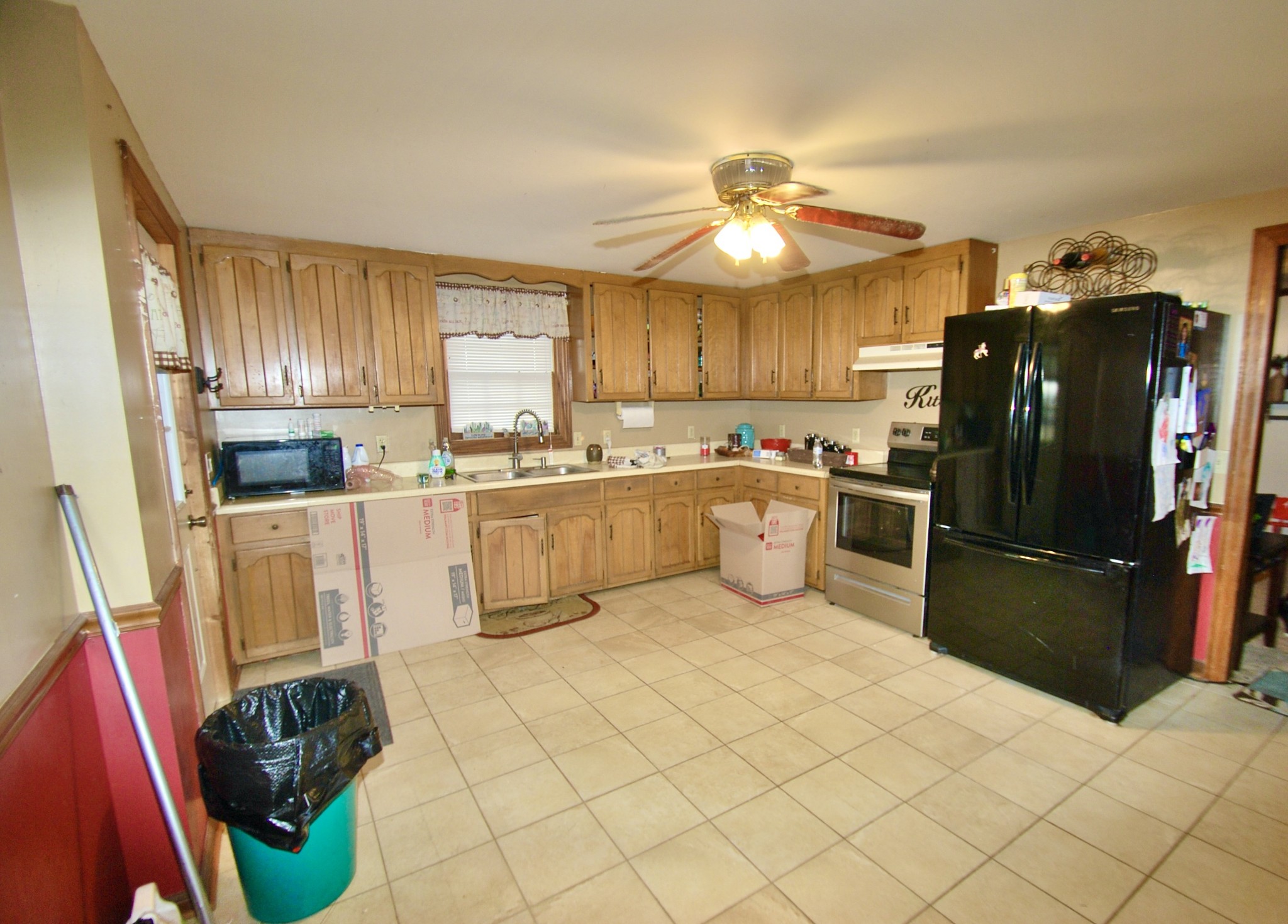 6006 Valley Road Springfield, TN 37172 - Photo 4 of 15 a kitchen with stainless steel appliances a stove a refrigerator and a sink