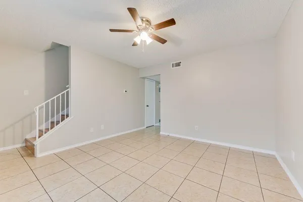 a kitchen with a stove sink and cabinets
