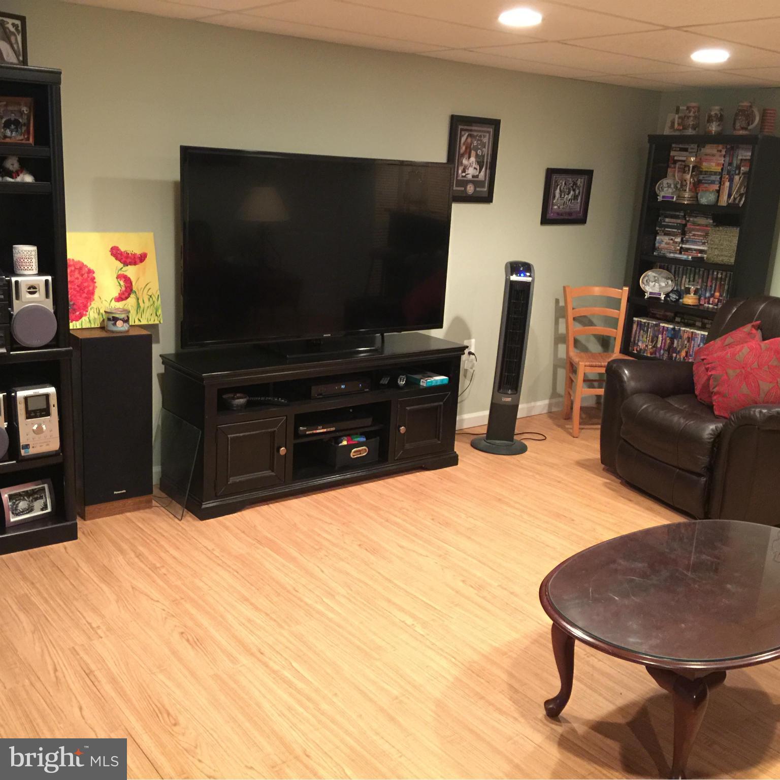 305 Westowne Road Baltimore, MD 21229 - Photo 22 of 30 a living room with furniture and a flat screen tv