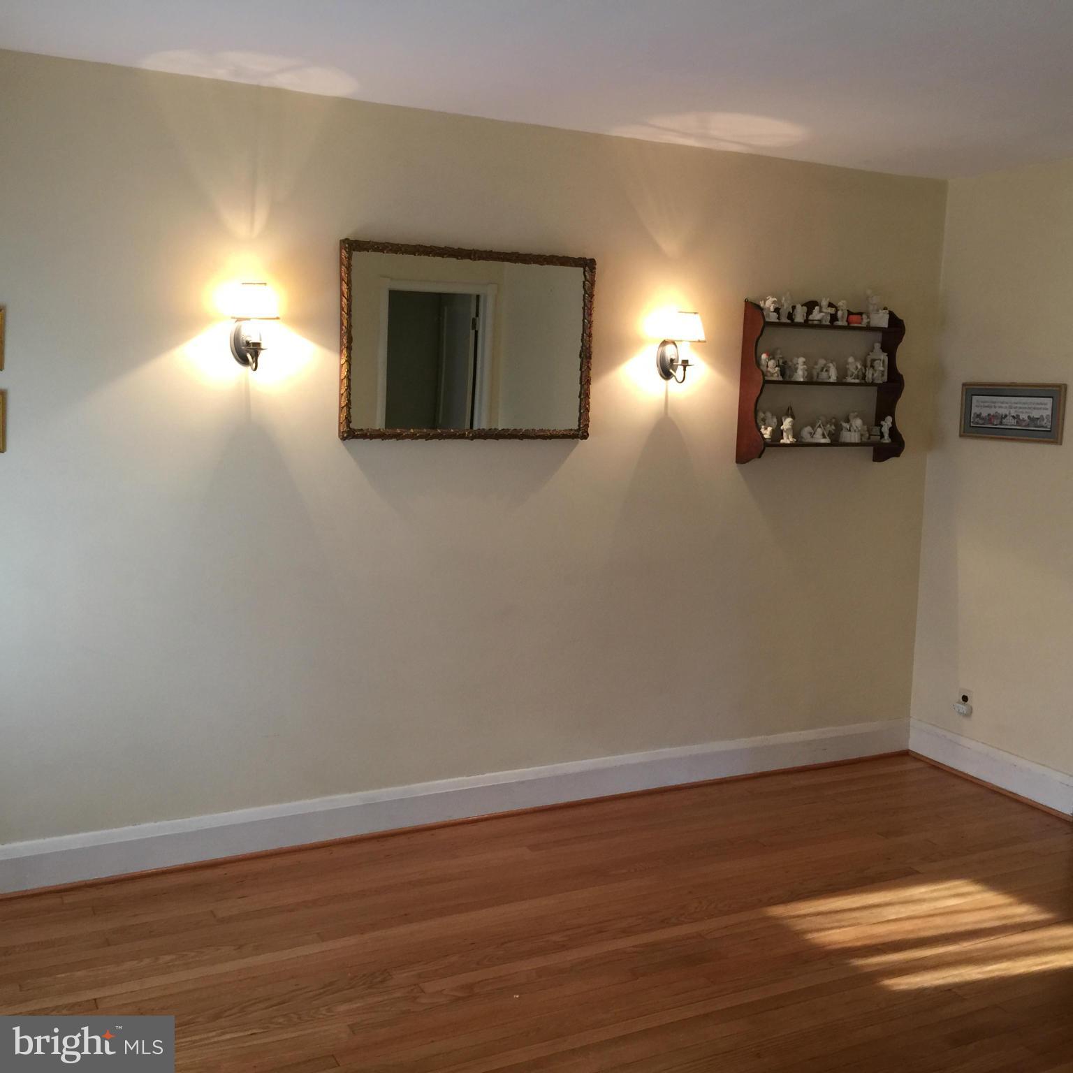 305 Westowne Road Baltimore, MD 21229 - Photo 8 of 30 a view of empty room with wooden floor