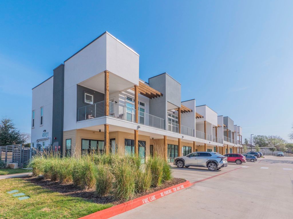4901 Springdale Road, Unit 103 Austin, TX 78723 - Photo 1 of 26 a front view of a building with garden