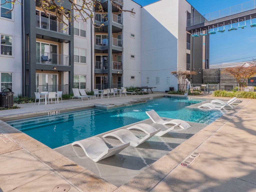 4901 Springdale Road, Unit 103 Austin, TX 78723 - Photo 23 of 26 a view of a house with a swimming pool