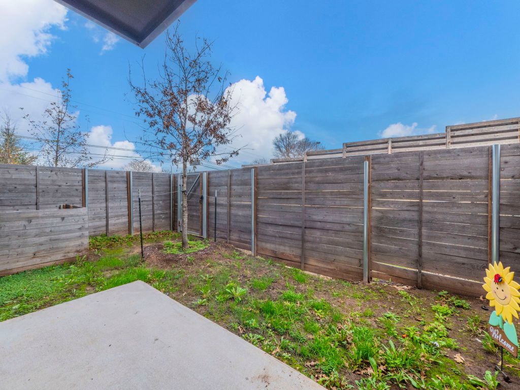 4901 Springdale Road, Unit 103 Austin, TX 78723 - Photo 26 of 26 a view of a backyard with a fence
