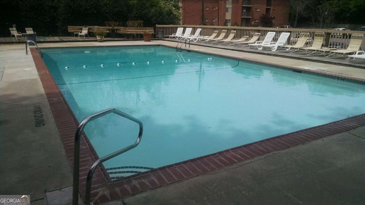 250 Little Street, Unit A301 Athens, GA 30605 - Photo 13 of 15 a view of a swimming pool with outdoor seating