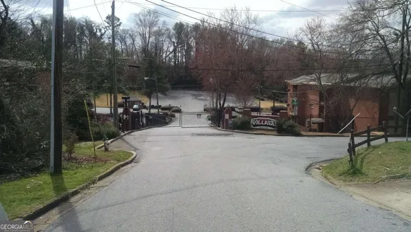 a view of a park with iron fence