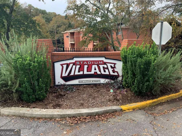 a sign that is on a brick wall