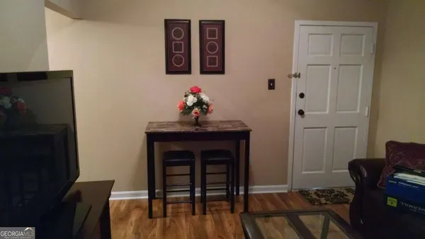 a view of dining room with furniture and wooden floor