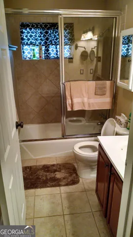 a bathroom with a bathtub and shower