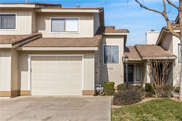 a front view of a house with garage