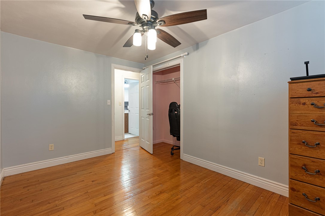 5235 West Ridgewood Road Springfield, OH 45503 - Photo 12 of 32 This spacious bedroom features lustrous hardwood flooring and an open closet for practical living.