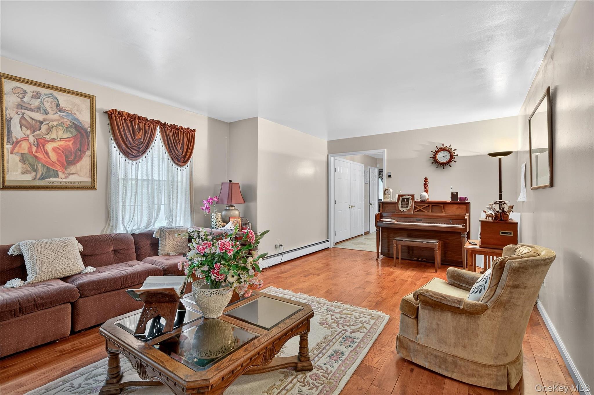 72 Peddler Hill Road Monroe, NY 10950 - Photo 11 of 50 a living room with furniture a table and a potted plant