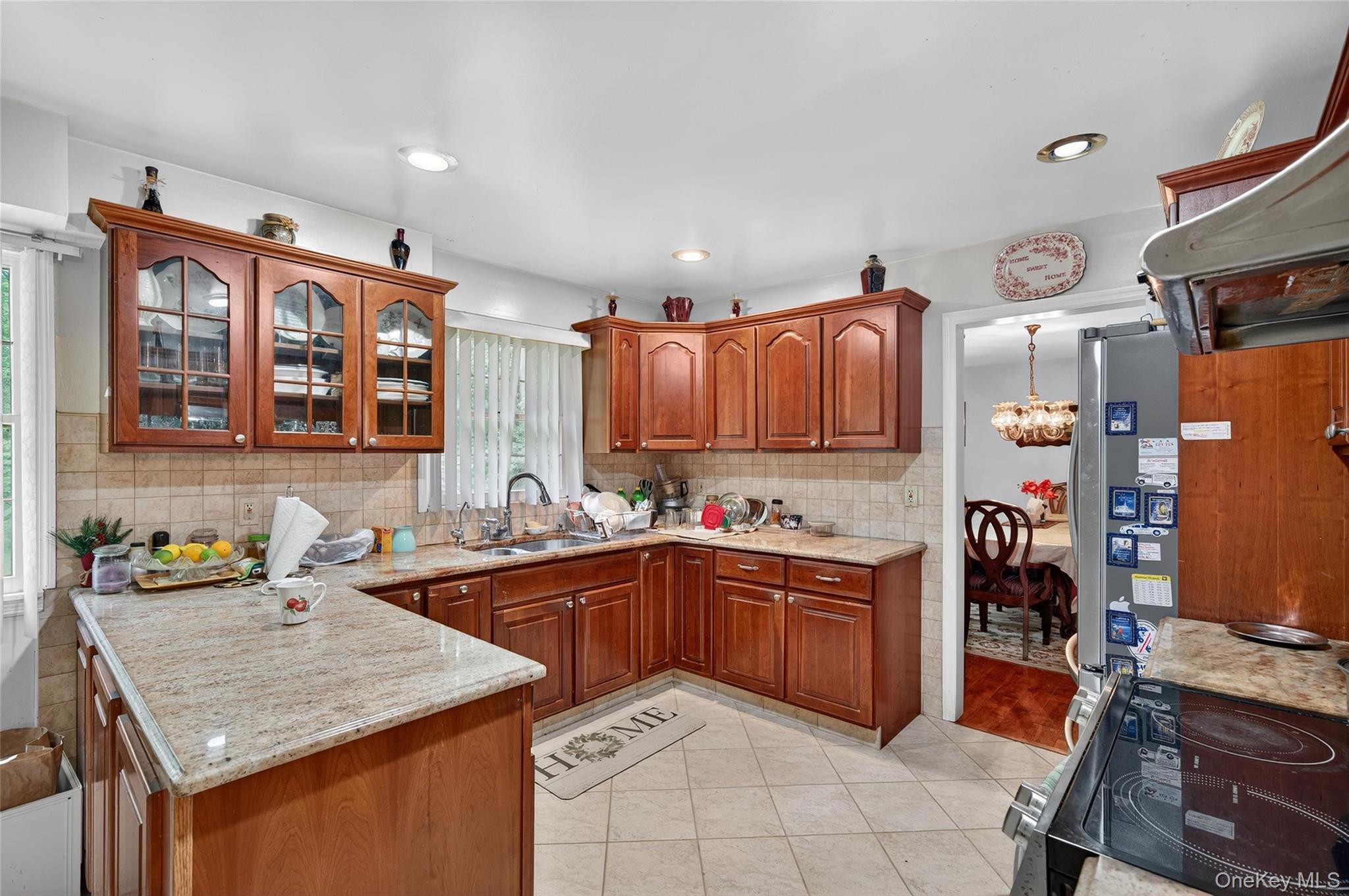 72 Peddler Hill Road Monroe, NY 10950 - Photo 17 of 50 a kitchen that has a lot of cabinets in it and wooden floors