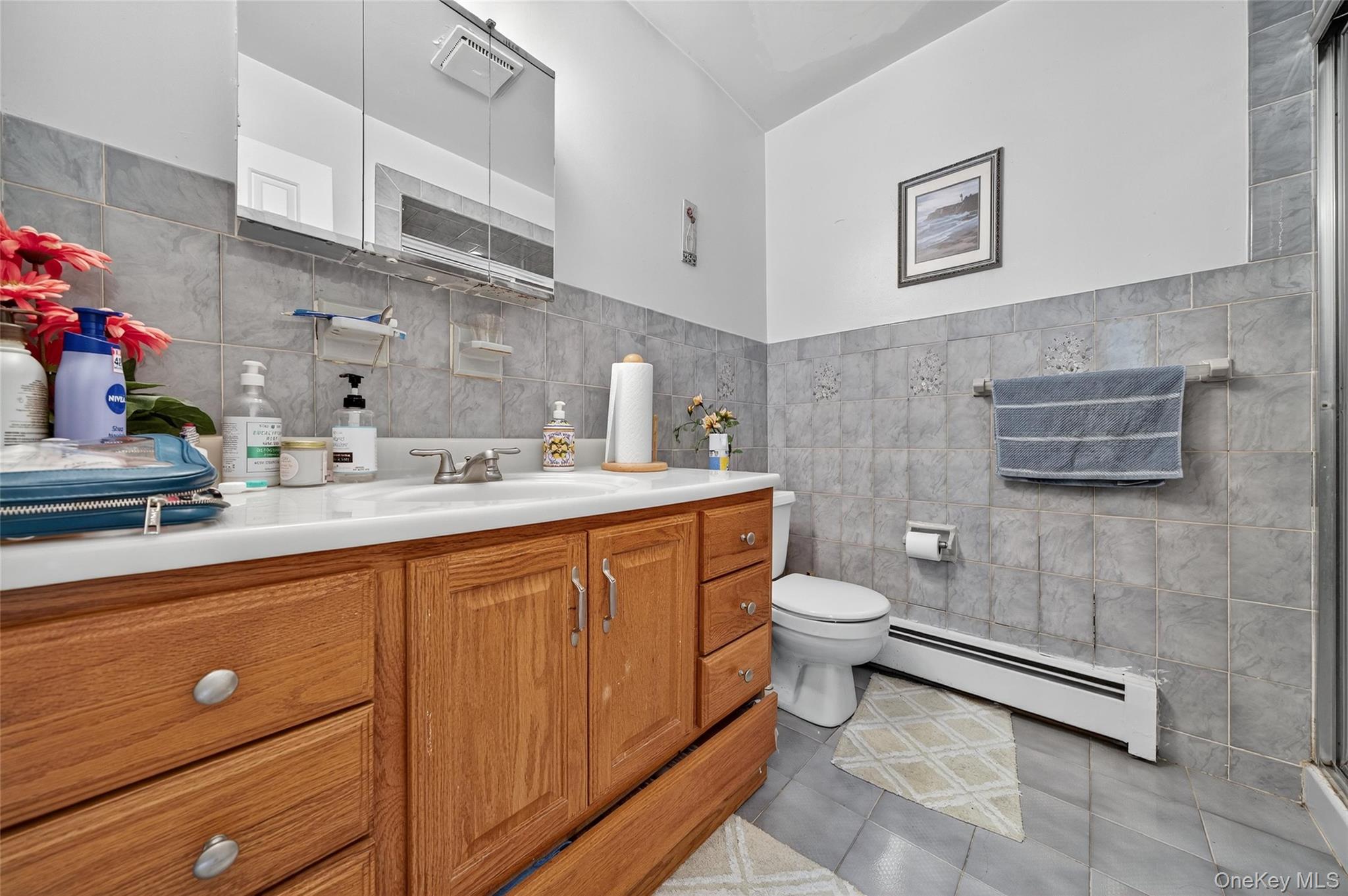 72 Peddler Hill Road Monroe, NY 10950 - Photo 25 of 50 a bathroom with a toilet sink and mirror