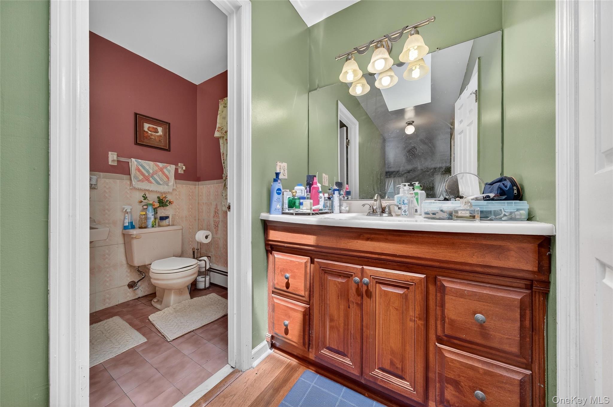 72 Peddler Hill Road Monroe, NY 10950 - Photo 30 of 50 a bathroom with a sink vanity and a mirror