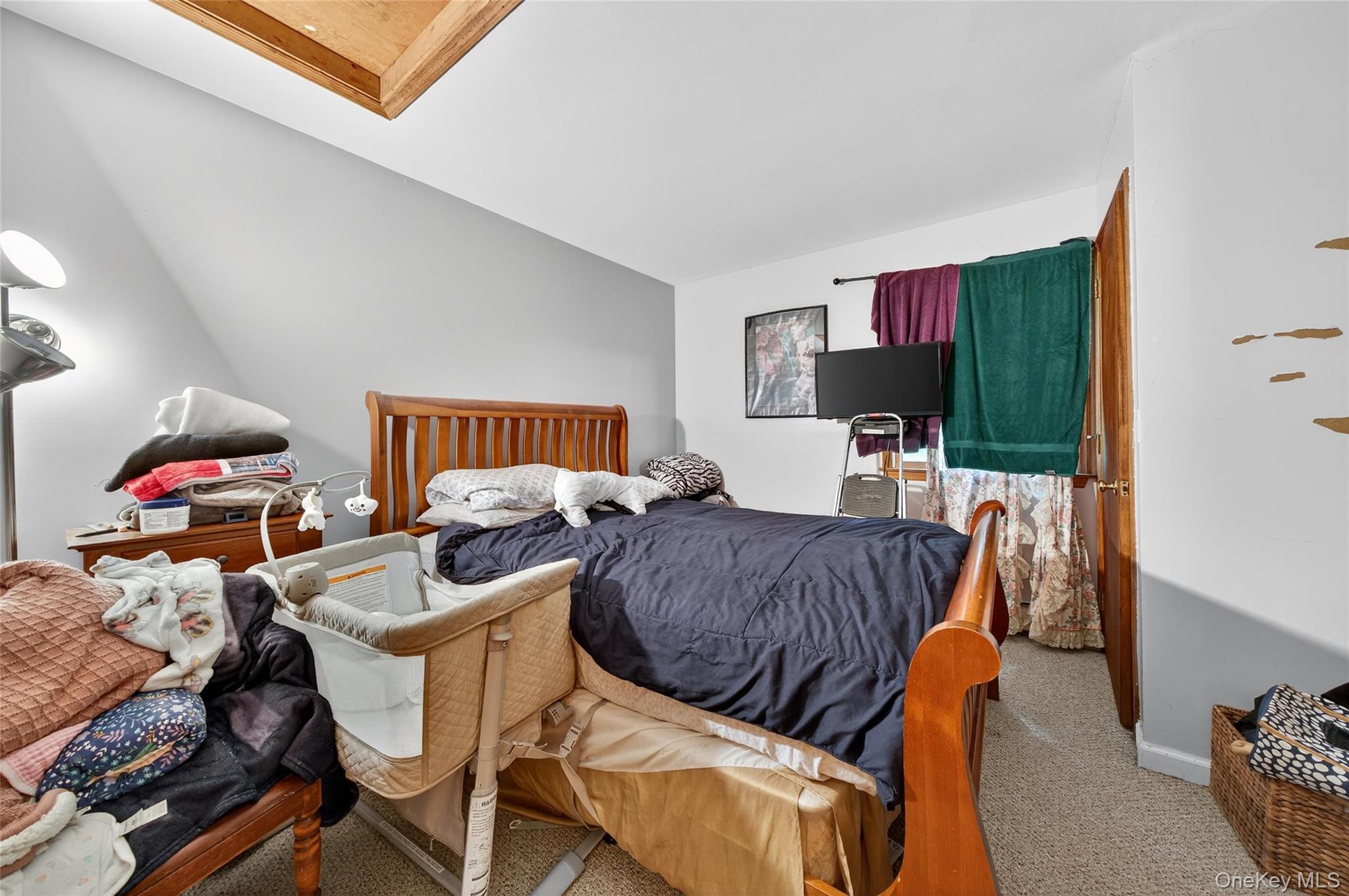 72 Peddler Hill Road Monroe, NY 10950 - Photo 32 of 50 a living room with furniture and a flat screen tv