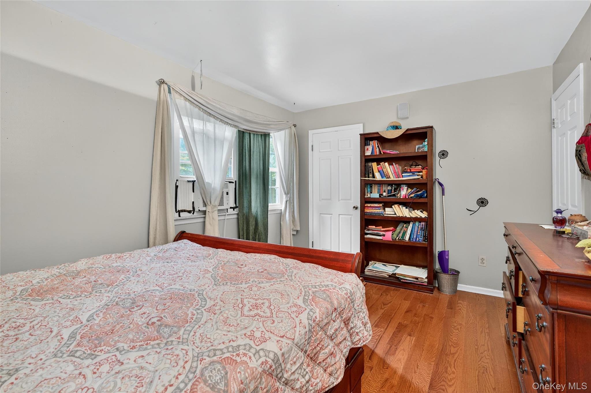 72 Peddler Hill Road Monroe, NY 10950 - Photo 36 of 50 a bedroom with a bed a large window and book shelf