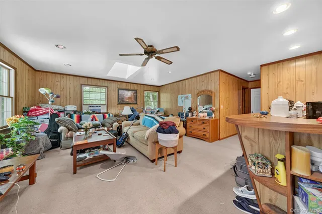 a bedroom with a large bed and a wooden floor