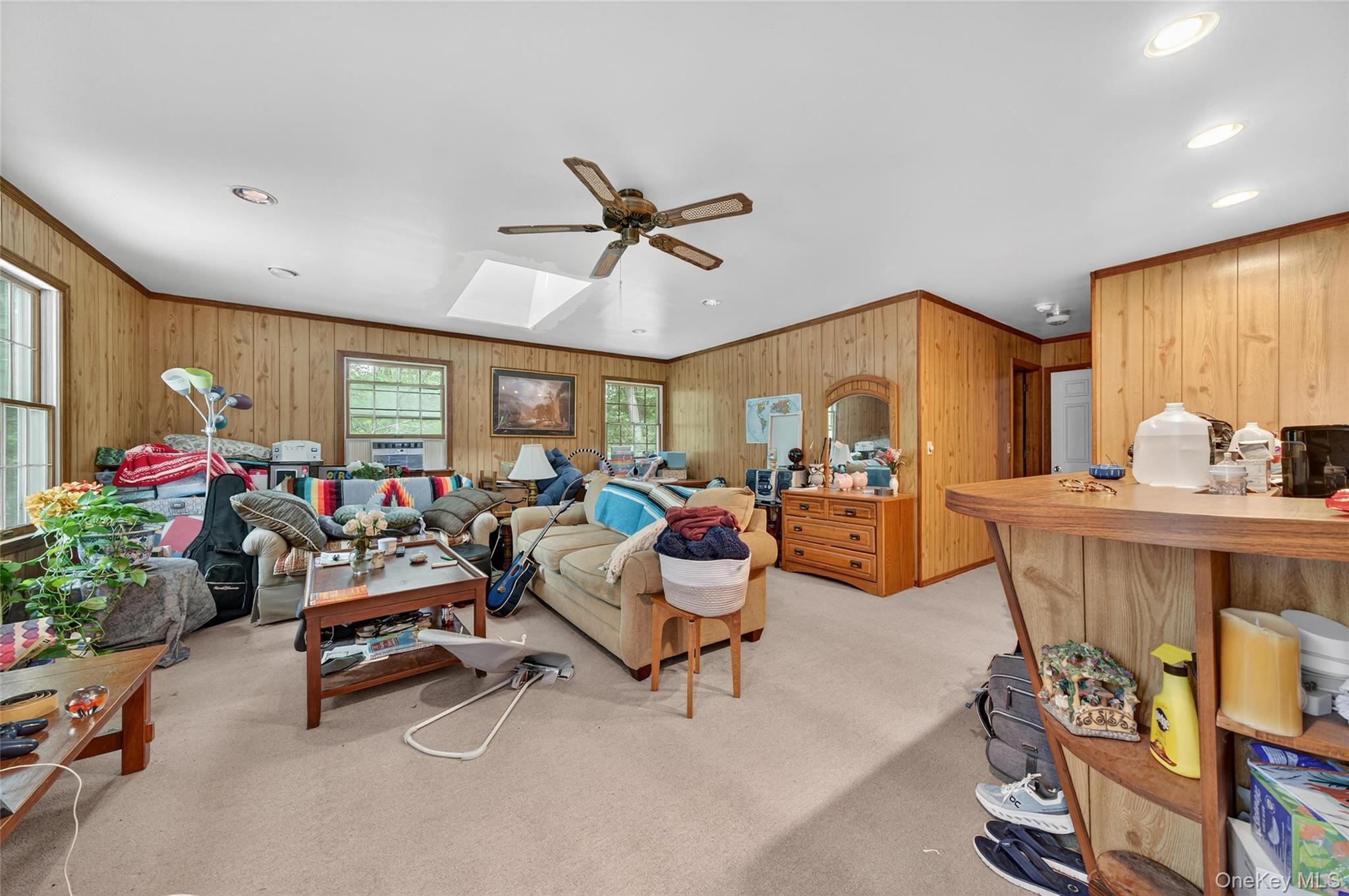72 Peddler Hill Road Monroe, NY 10950 - Photo 41 of 50 a living room with furniture a window and gym equipment