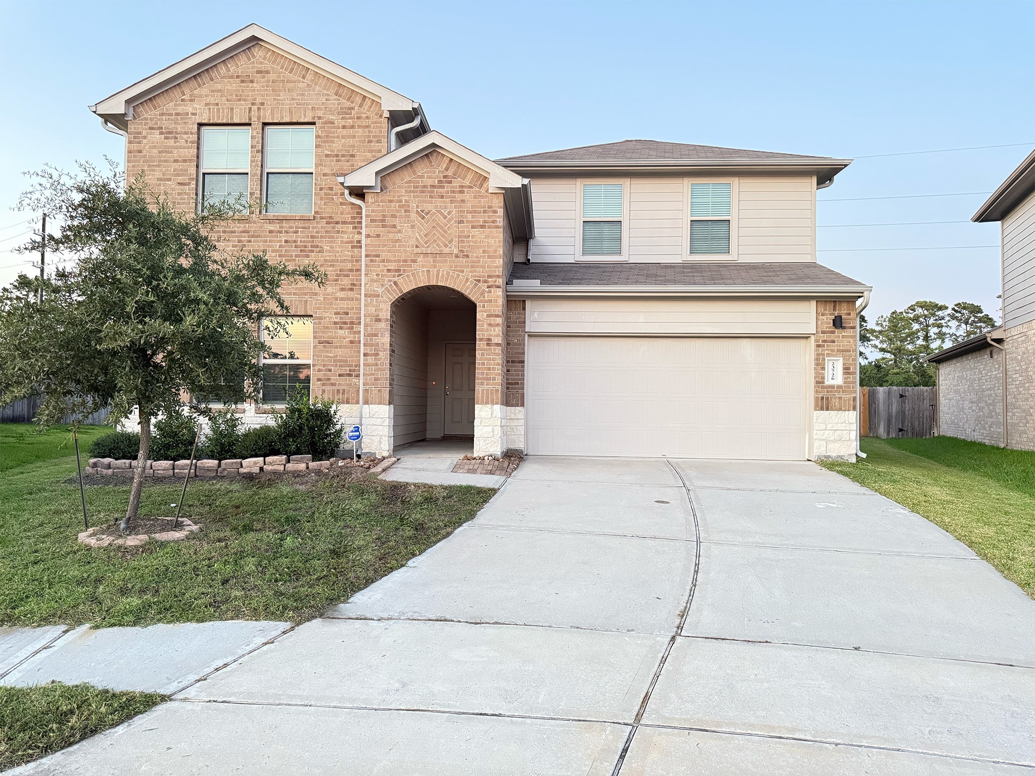 23726 Harrow Field Ln Spring Spring, TX 77373 - Photo 1 of 16 a front view of a house with a yard and garage