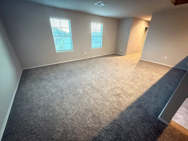 a view of an empty room and window