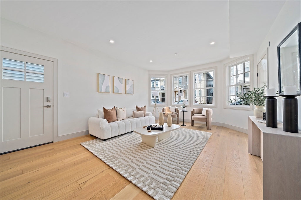 59 Falcon Street, Unit 2 Boston, MA 02128 - Photo 4 of 19 a living room with furniture large window and wooden floor