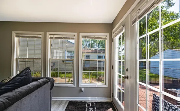 a living room with furniture and windows