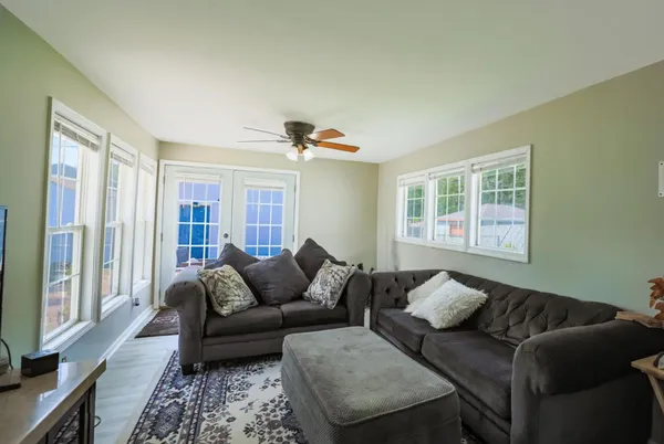 a living room with furniture and a window