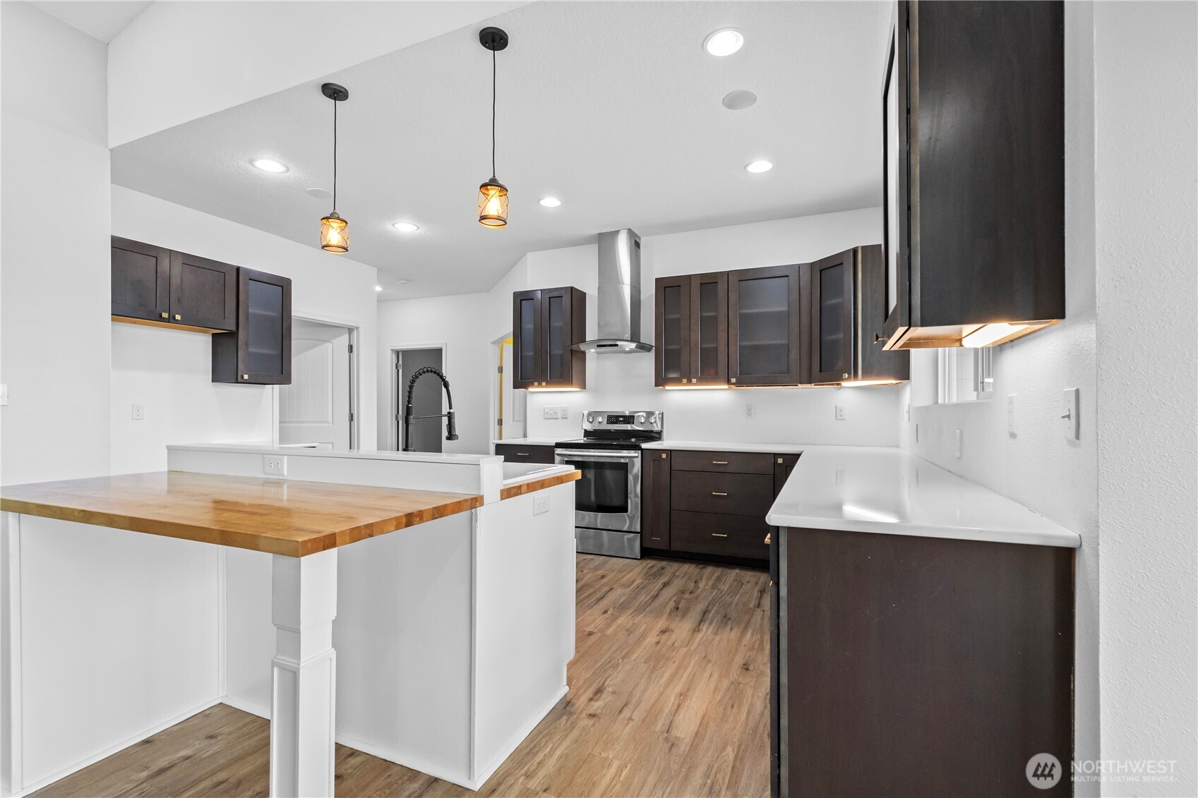 249 Flatt Road Kelso, WA 98626 - Photo 14 of 39 a kitchen with stainless steel appliances granite countertop a sink a stove and a refrigerator
