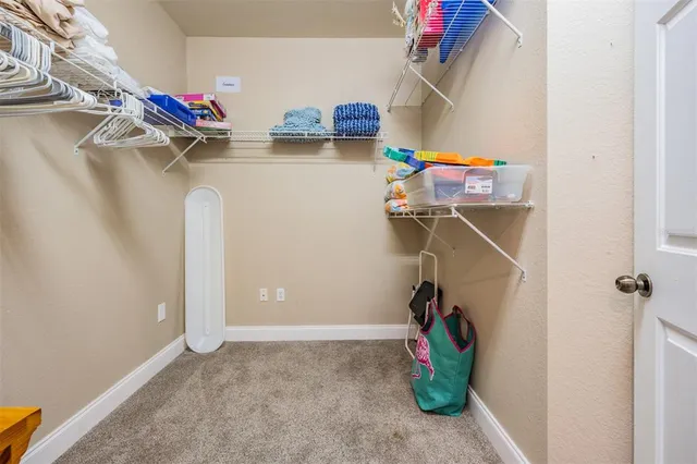 a bathroom with a granite countertop sink mirror vanity and toilet