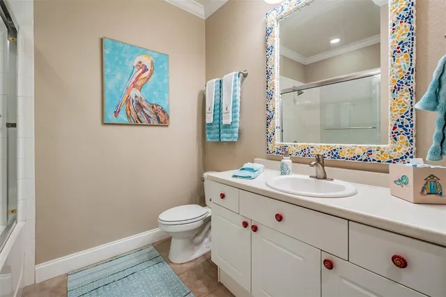 a bathroom with a glass shower door