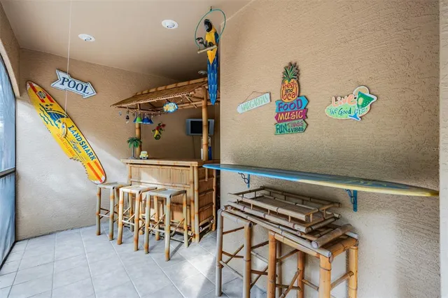 a kitchen with stainless steel appliances granite countertop a stove a refrigerator and a wooden cabinets