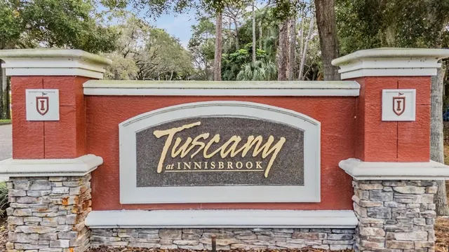 a dining room with furniture and a floor to ceiling window