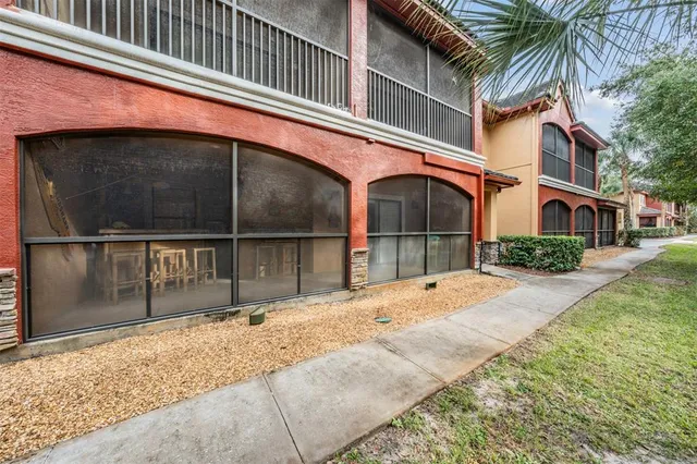 a living room with furniture and a pool table