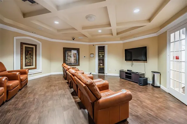 a room with furniture pool table and window