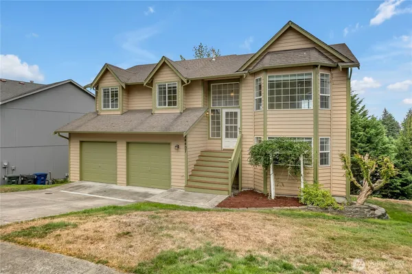 a front view of a house with a yard